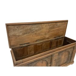 17th century design oak coffer or chest, rectangular hinged top over moulded frieze rail, the panelled sides applied with carved arcade decoration with scrolling foliate corners, flanked by guilloche carved uprights 