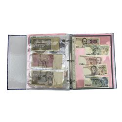 Coins and banknotes from the 'Money of the World' collection, including Central Bank of Ceylon, Bahrain Currency Board, Seychelles, Bank of Sierra Leone, South African Reserve Bank, Serbia, Central Bank of the Gambia etc, housed in seven ring binder folders