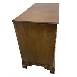 George III mahogany chest, the rectangular moulded top over two short and three long mahogany lined graduating drawers with scratch moulding, fitted with circular beaded handle plates and swan neck handles, raised on ogee supports, solid mahogany top and sides