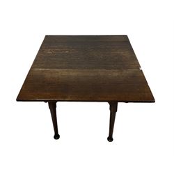 Late 18th century oak six legged drop leaf dining table, raised on turned supports, terminating in pad feet