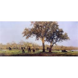David Shepherd (British 1931-2017): 'Luangwa Evening', limited edition colour print signed in pencil blindstamped and numbered 521/1500 together with his book 'Man and his Paintings', 30cm x 66cm (2)