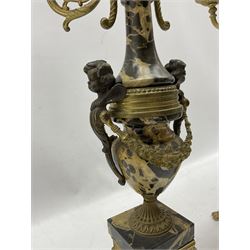 Pair late 19th century six branch table candelabra, the branches cast with Griffon heads and ornate foliate scrolls, the central column of polished marble segments mounted by cherubs adorning each side united by foliate garlands, stepped base decorated with flower head patterned drapery, on four splayed paw cast feet H70cm (2)