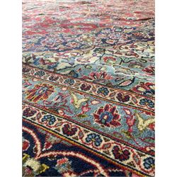 Persian rug, one central navy medallion with red field and floral motifs, surrounded by multiple borders 303cm x 430cm