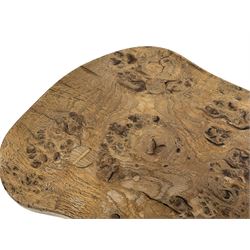 Beaverman - three-legged oak stool, the shaped figured burr top carved with beaver signature, on octagonal splayed supports, by Colin Almack, Sutton-under-Whitestone Cliffe, Thirsk