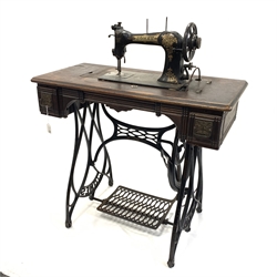 Vintage Jones treadle sewing machine,  walnut top with two drawers raised on cast metal base,  W86cm