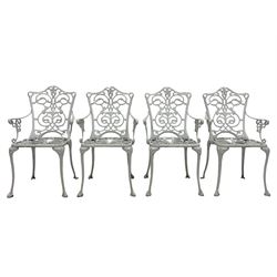 Cast aluminium white painted circular garden table with pierced foliate and scroll decoration; set four four matching chairs, the backs and seats pierced and patterned, on cabriole supports; and coffee table raised on cabriole supports with acanthus detail