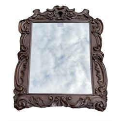 Wall mirror, the rosewood scroll carved frame enclosing mirror 