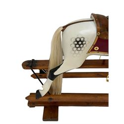 F. Ayres of London - early 20th century dapple grey rocking horse, with leather saddle and brass stirrups, on trestle base with turned pillars, recently restored