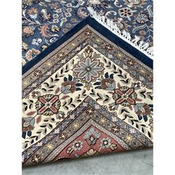 Persian blue ground rug, ivory medallion on blue field decorated with interlaced foliate, 365cm x 278cm