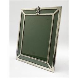 Silver upright table photograph frame, the top rail with a figure of St Andrew, in an easel frame 28cm x 22cm Birmingham 1915 Maker Gorham Manufacturing Co.