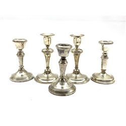 Pair of silver dressing table candlesticks Birmingham 1918 H13cm, a smaller pair H11cm and a similar single candlestick
