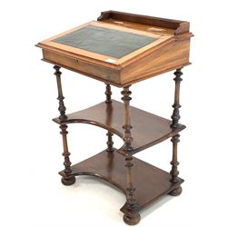 Late Victorian walnut davenport writing desk, the galleried back lifting to reveal pen tray and storage compartments, over skivered writing slope lifting to reveal plain interior, two tiers under raised on spindle supports, compressed bun feet to base W53cm