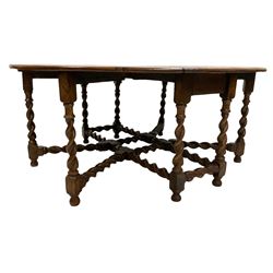 19th century oak drop-leaf dining table, oval top with quadruple gate-leg action base, spiral turned supports united by spiral turned stretchers