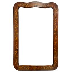 18th century Dutch walnut marquetry wall mirror, the shaped frame decorated with trailing foliate inlays and stringing, plain mirror plate