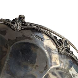 Silver circular fruit bowl with shell moulded border and lappet decoration, swing handle raised on shell moulded feet D24cm Sheffield 1917 Maker James Dixon & Sons Ltd 19oz