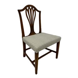 George III mahogany elbow chair, the slatted back reeded over upholstered seat, raised on tapered reeded supports with spade feet; George III country oak dining chair with pierced splat back; 19th century mahogany towel rack with turned uprights; Edwardian mahogany dining chair (4)