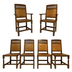 Lizardman - set six oak dining chairs, carved lattice panel to back, tan leather seat and back with stud bands, on octagonal supports joined by plain stretchers, craved with lizard signature, four side chairs and two carvers, by Derek Slater of Crayke