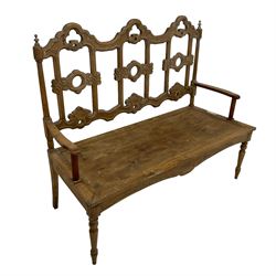 French Gothic design pine bench, open back pierced and carved with scrolls, on turned front supports