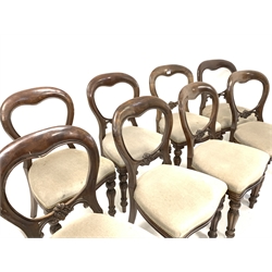 Set eight Victorian style balloon back dining chairs with floral carved rail over upholstered seat, turned and lobe carved front supports 
