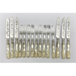 Set of six Edwardian silver bladed dessert knives with mother of pearl handles engraved with a monogram and nine matching forks Sheffield 1902/3 Maker James Dixon & Son 