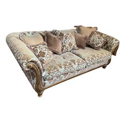 Gascoigne - 'Victoria' three seat sofa, carved and gilt finished wood frame with scrolled arms, the lower upright with carved foliate decoration, upholstered in gryphon and crown patterned fabric