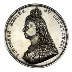 Official silver medal commemorating the Golden Jubilee of Queen Victoria in 1887, designed by the medallist Joseph Edgar Boehm and produced by The Royal Mint, the obverse with bust facing left reading 'Victoria Regina Et Imperatrix', the reverse with seated Monarch surrounded by subjects and winged figures above, diameter approximately 77mm, weight approximately 222.8 grams 