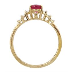 9ct gold oval ruby ring, with stepped baguette cut diamond shoulders, hallmarked