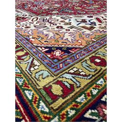 Hand knotted Persian rug, with navy blue boarder with red field 393cm x 310cm 