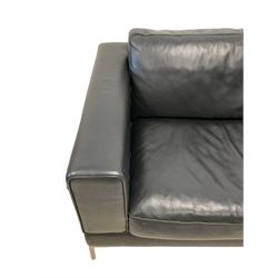 Three seat sofa upholstered in black leather, on tubular polished metal frame and feet