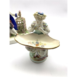 Meissen figural sweetmeat dish formed as a seated lady, H16cm, Sitzendorf porcelain figure group of dancing courtiers, another Sitzendorf group of a courting couple and one other (4)