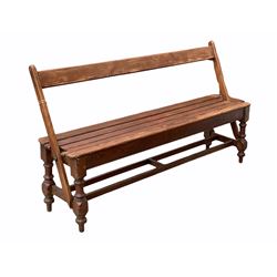 Victorian pine two way bench, the swing over back over slatted seat, raised on turned supports united by double stretcher, reputedly from a railway platform L150cm