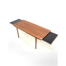 Mid century teak coffee table, with ebonised draw leaf to each end, raised on tapered supports 