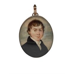 English School - Early 19th century oval miniature head and shoulders portrait on ivory of a young gentleman in gilt metal frame 6.5cm x 5cm