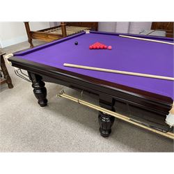 Riley - full-sized 12' x 6' slate bed snooker table, mahogany frame with purple baize, raised on turned and fluted baluster supports, recently refurbished; together with, cues, scoreboard, cover, snooker and pool balls

Viewing by appointment at the Vine Street Saleroom, Scarborough. 