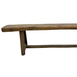 Large 19th century oak bench or pew, rectangular canted top, raised on trapezoid end supports united by stretcher