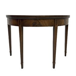 George III mahogany demi-lune tea table, foldover top on twin swing action base, square tapering supports on spade feet