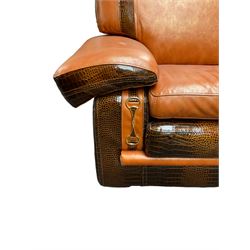 Formitalia - two seat sofa upholstered in orange leather with crocodile skin design patent trimming, padded arm rests above gilt buckle uprights, on block feet