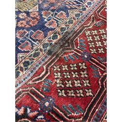 Handknotted Persian rug from Sanandaj region with five red medallions, navy field and red border (394cm x 275cm