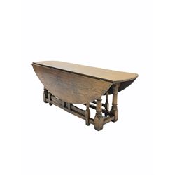 17th century style medium oak coffee table, the oval top with two drop leaves and four gate leg action, turned and block supports united by stretchers W122cm