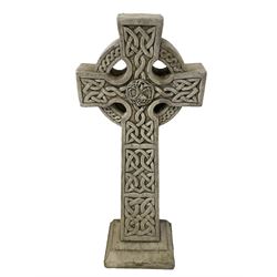 Composite stone Celtic Cross garden ornament, the central tree of life motif within the interlaced nimbus, the arms and stem enclosing celtic knots, raised on stepped base