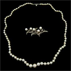 Single strand graduating pearl necklace, with white gold clasp by Mikimoto and a Mikimoto silver pearl brooch