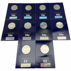 Eight Queen Elizabeth II United Kingdom fifty pence coins and two two pound coins, each housed in a 'Change Checker' card