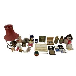 Eight day bedside watch in leather case, box of coins, brass table lamp, brass inkstand, various soft toys, two stoneware bottles, badges etc