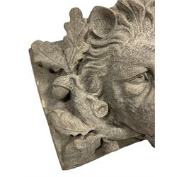 Composite lion mask wall mounted fountain, the agape jaws clutching an oak branch with extending leaves and acorns