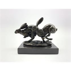 Bronze figure group, modelled as two hares in chase, signed 'Nick' and with foundry mark, upon a rectangular polished marble plinth, overall H12cm x L12.5cm