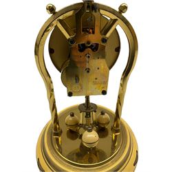 A 20th century 400-day Torsion suspension clock manufactured by the Schatz (Jahresuhrenfabrik) clockmaking company in Triburg ,Germany, with a three-ball rotating pendulum, enamel painted base with three adjustable feet and a 2-3/4” dial with floral decoration, gilt hands with Arabic numerals, with the original glass dome, box, paper work and a Schatz original replacement block and suspension.
Height 230mm, Base diameter 150mm
