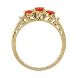 9ct gold three stone oval fire opal and baguette diamond ring, hallmarked
