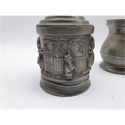 19th Century pewter tobacco jar and cover of cylindrical design cast with scenes from Mr Punch H17cm and four pewter baluster measures 