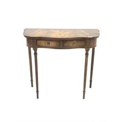 Reprodux Georgian style mahogany serpentine side table, with cross banded top over two frieze drawers, ring turned and fluted supports, W80cm