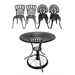 Black painted aluminium garden table and together with two pairs of chairs painted green, black and grey 